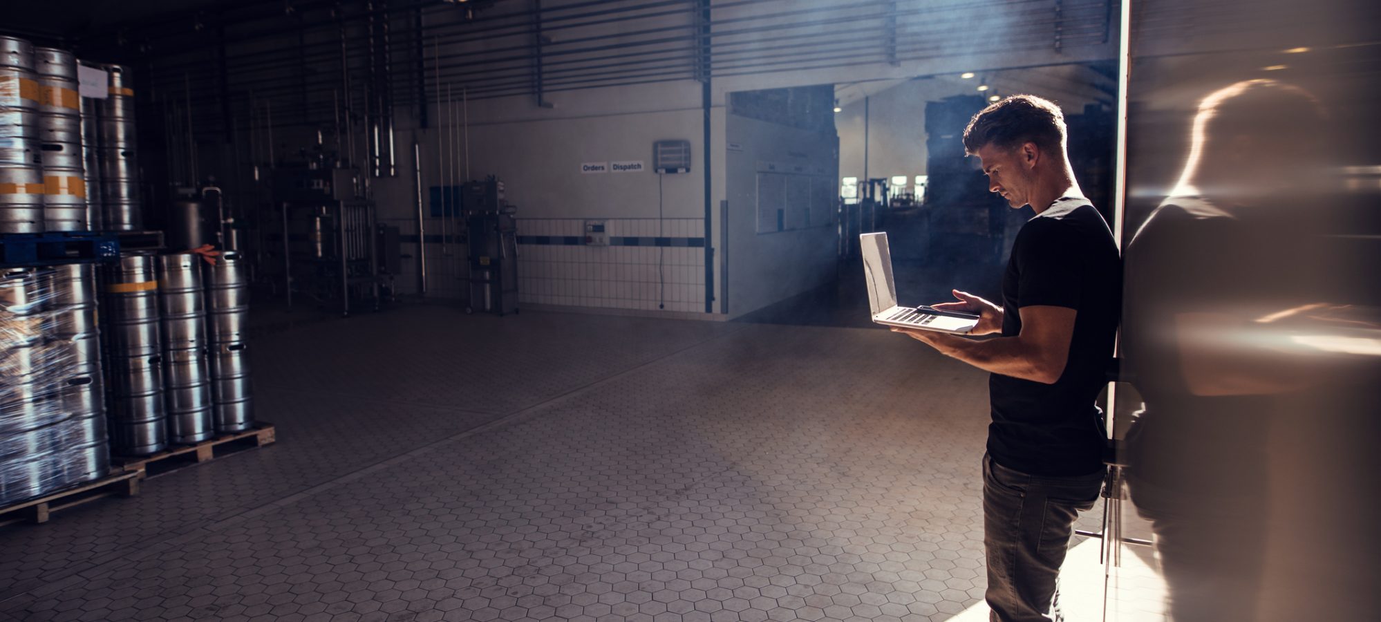 Image of brewery owner using laptop to research bonus depreciation