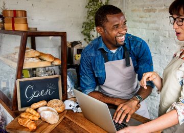 Image of two business owners in bakery who are starting a business