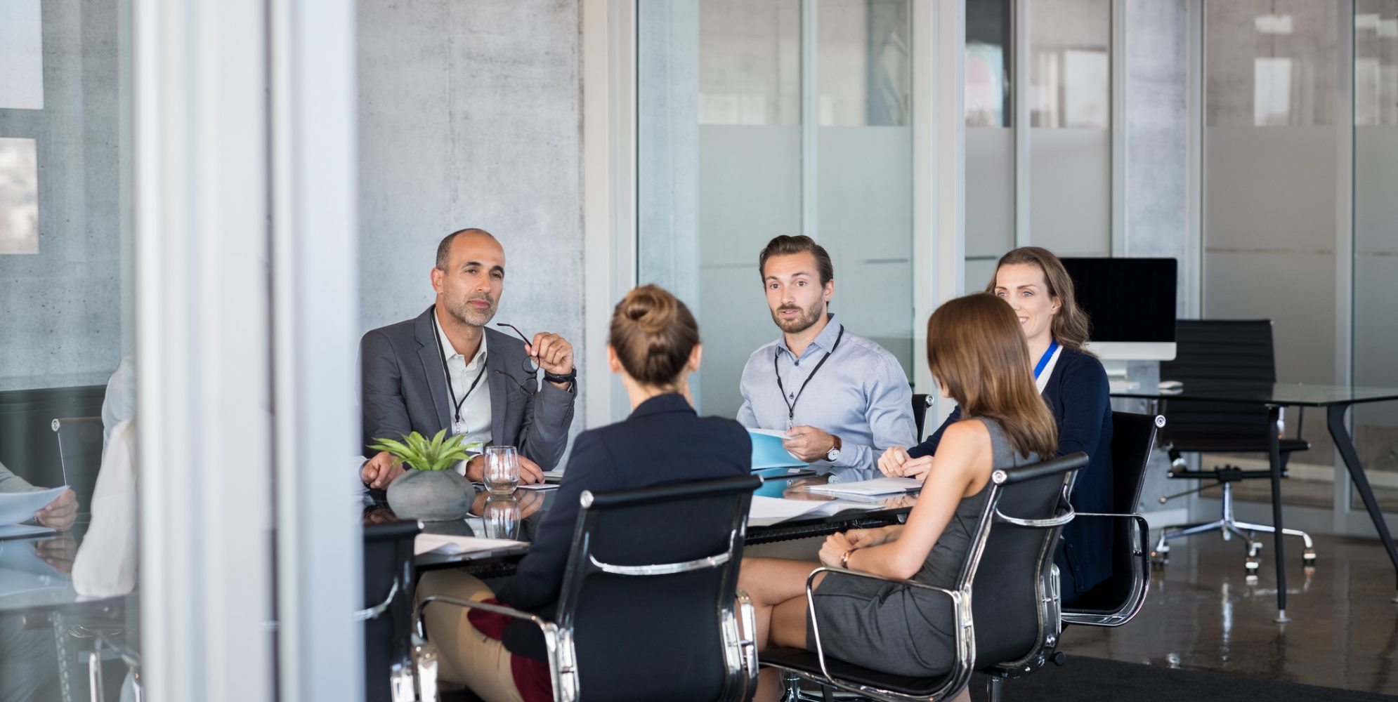 4 business experts meeting with a client regarding an ESOP valuation for her company