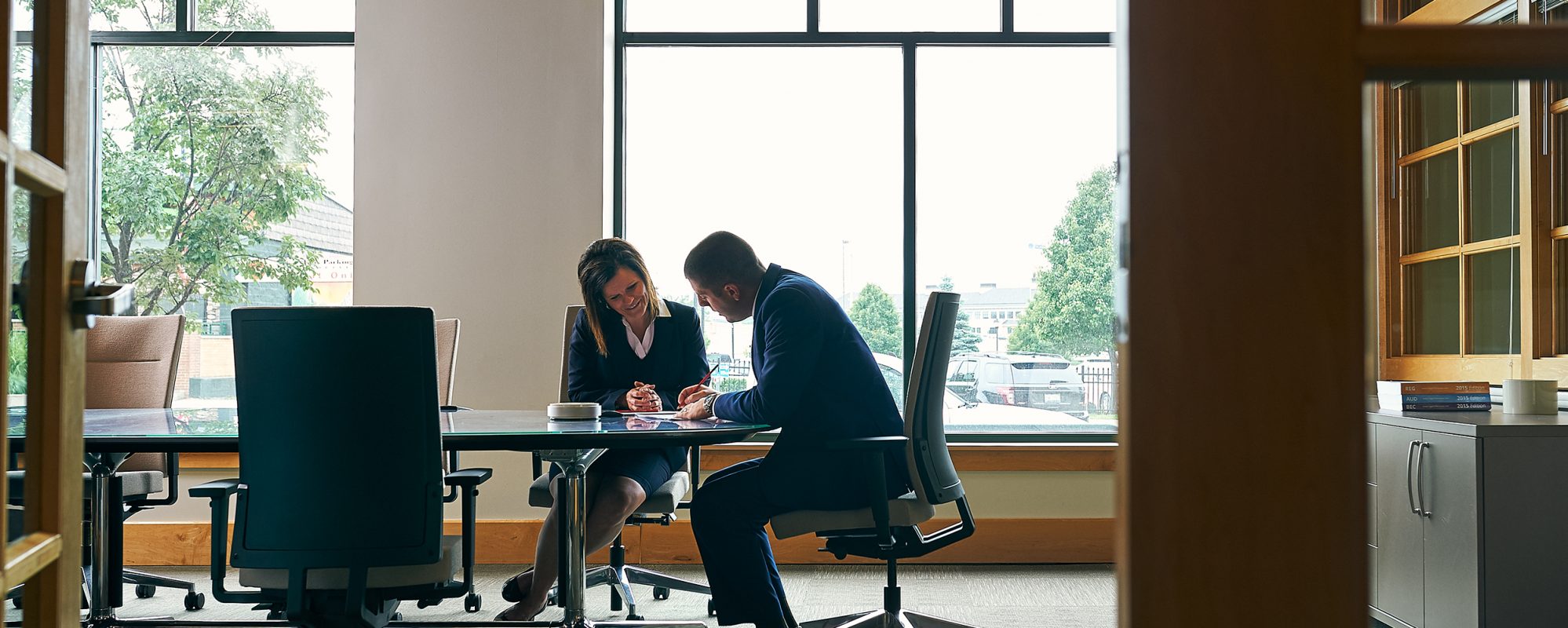 Image of Beene Garter employees working together in office on business tax page