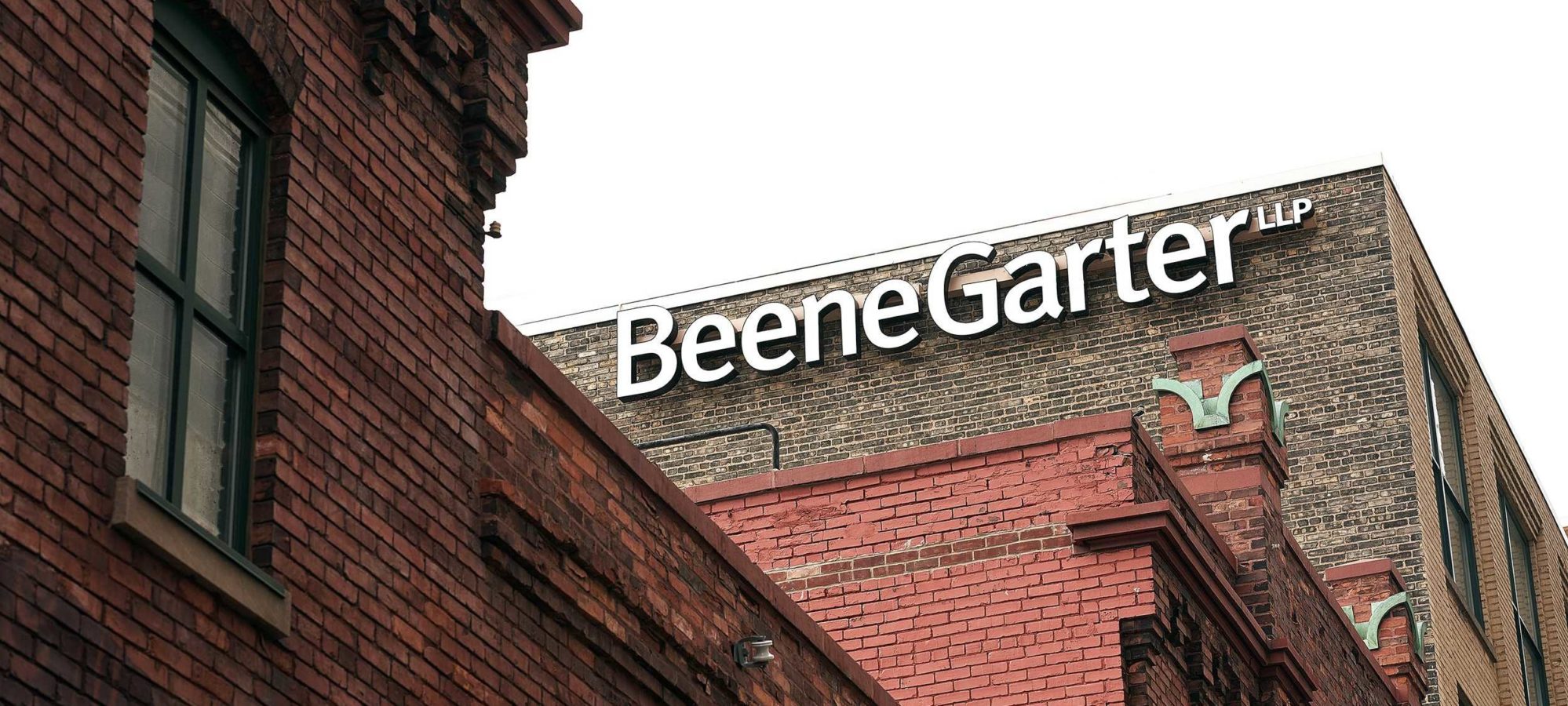 Beene Garter building and exterior sign in downtown Grand Rapids - IPA 300 Firm