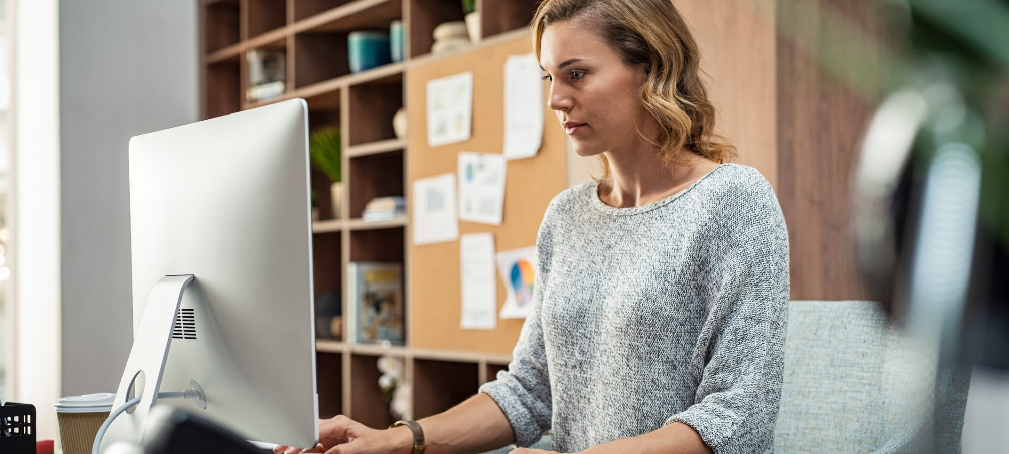 Business woman using computer to submit income information to Florida's department of revenue