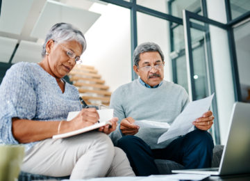 Couple reviewing and gathering tax documents for tax season