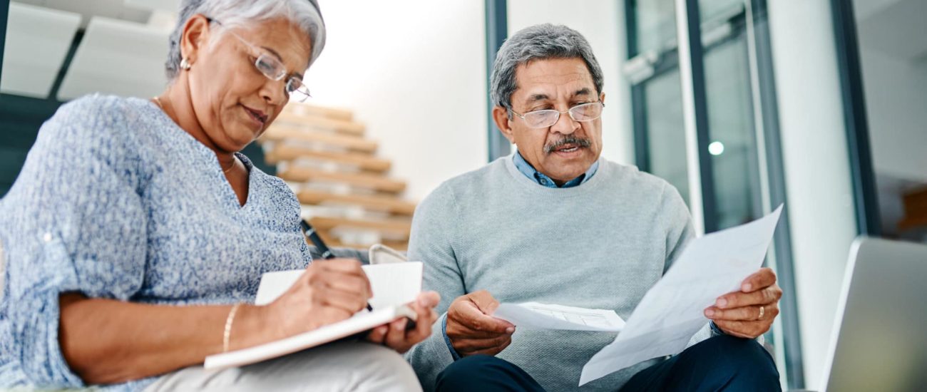 Couple reviewing and gathering tax documents for tax season