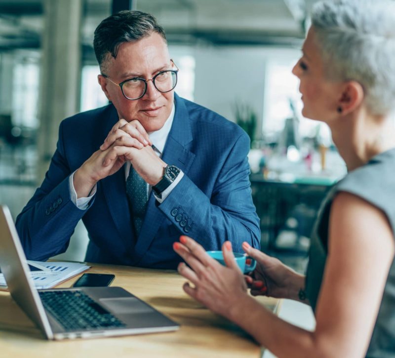 Two colleagues on a business meeting in a board room