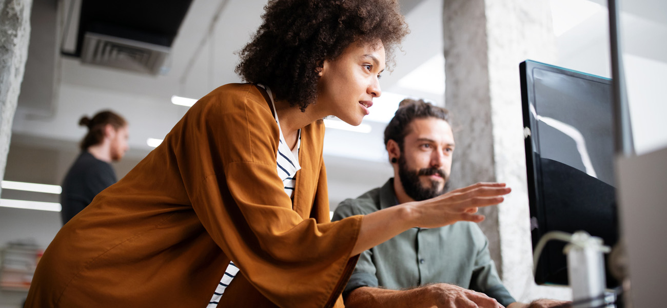 a woman discusses delay of payroll tax with a man