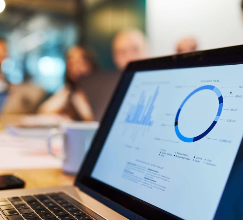 Close up of a laptop screen with charts and data in Sage Intacct software