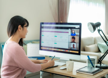 Business owner video chatting with experts about PPP loan forgiveness