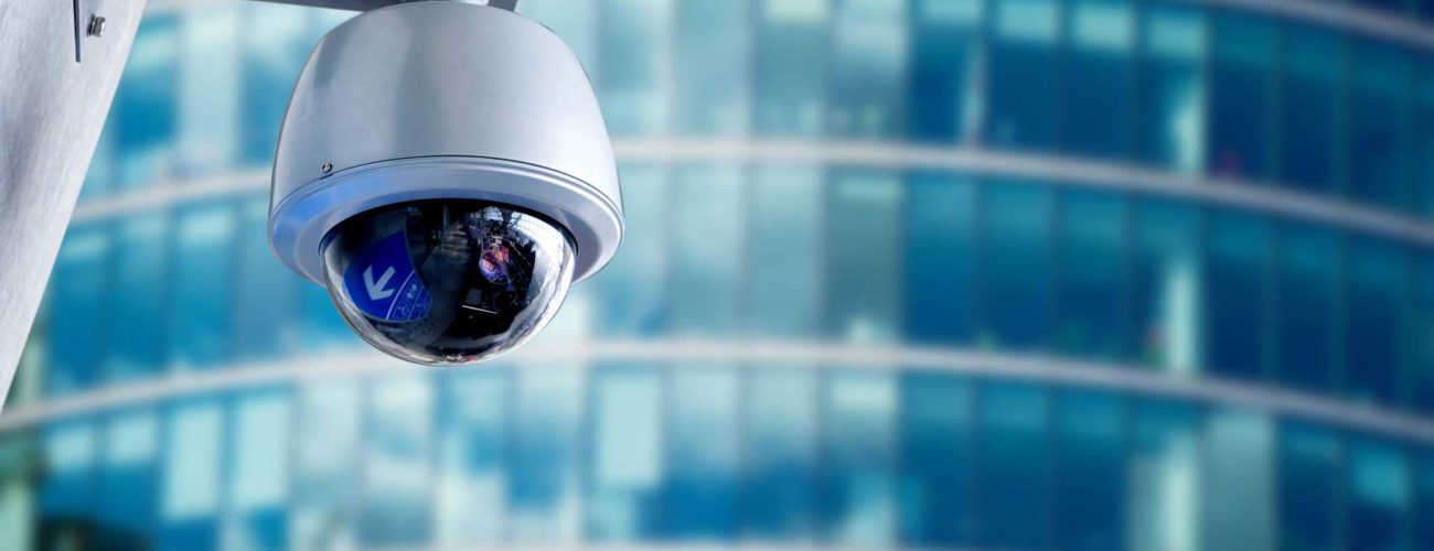 Security camera mounted on office building to detect fraud