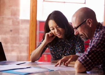 Client and accountant looking at tax return