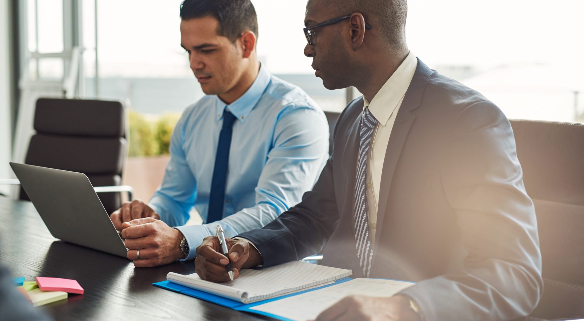 Two business executives in meeting and discussing the value of their business