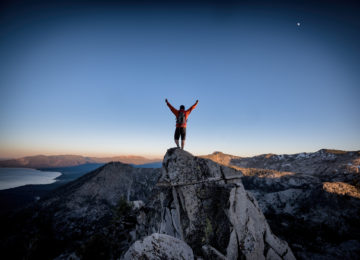 Climber reaches summit of mountain, represents nonprofits overcoming financial challenges