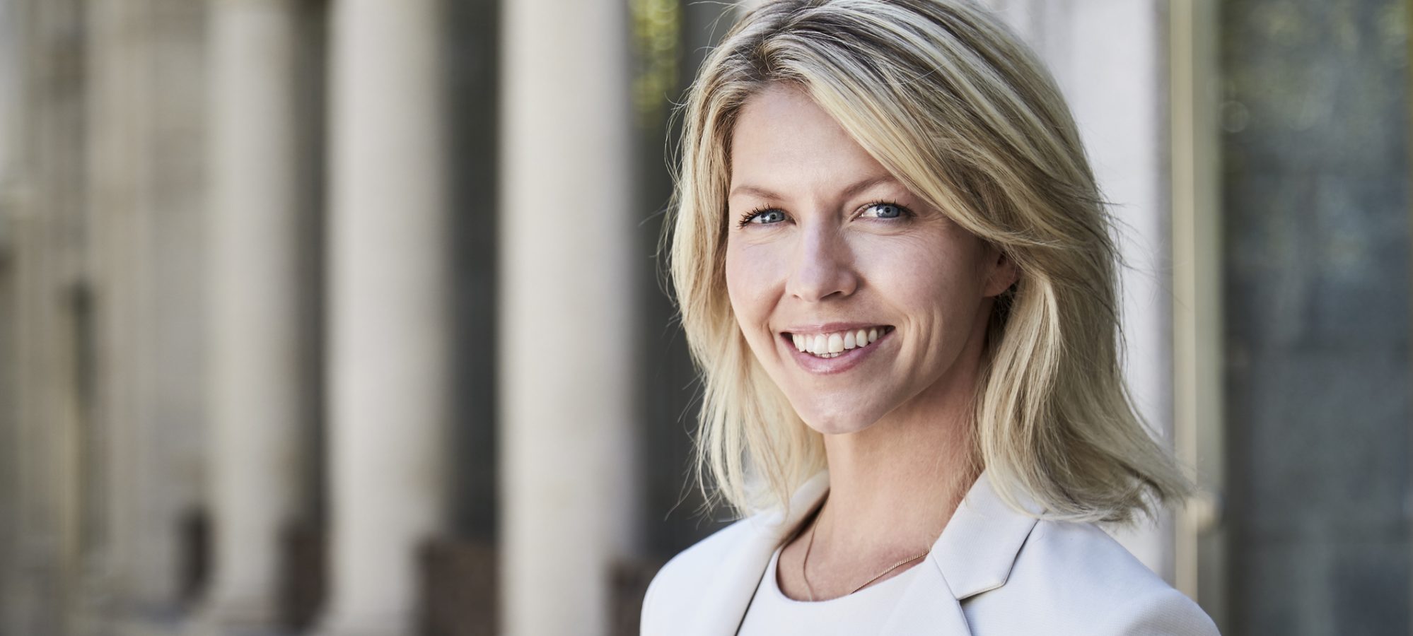 Image of woman accountant smiling at camera - Beene Garter has high percentage of female owners