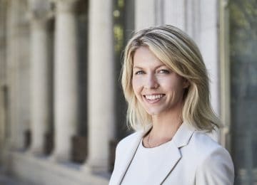 Image of woman accountant smiling at camera - Beene Garter has high percentage of female owners