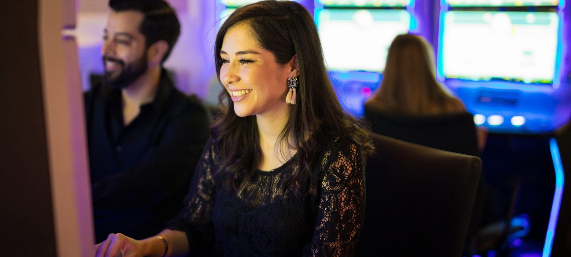 Image of young woman at a casino and winning - her prizes are taxable income