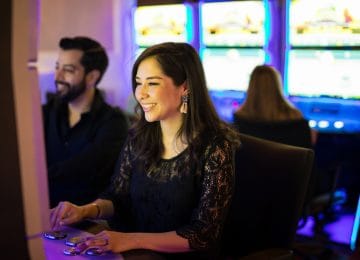 Image of young woman at a casino and winning - her prizes are taxable income