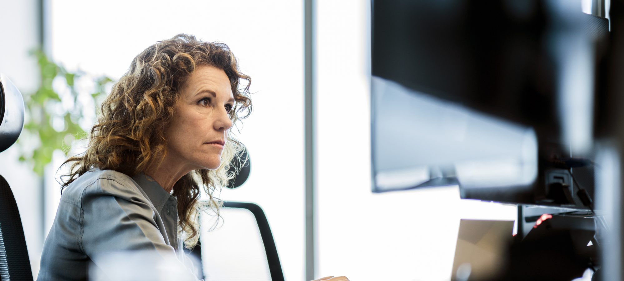 Image of business woman reviewing business and putting together business appraisal