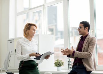 Image of buyer discussing how to raise capital with banker