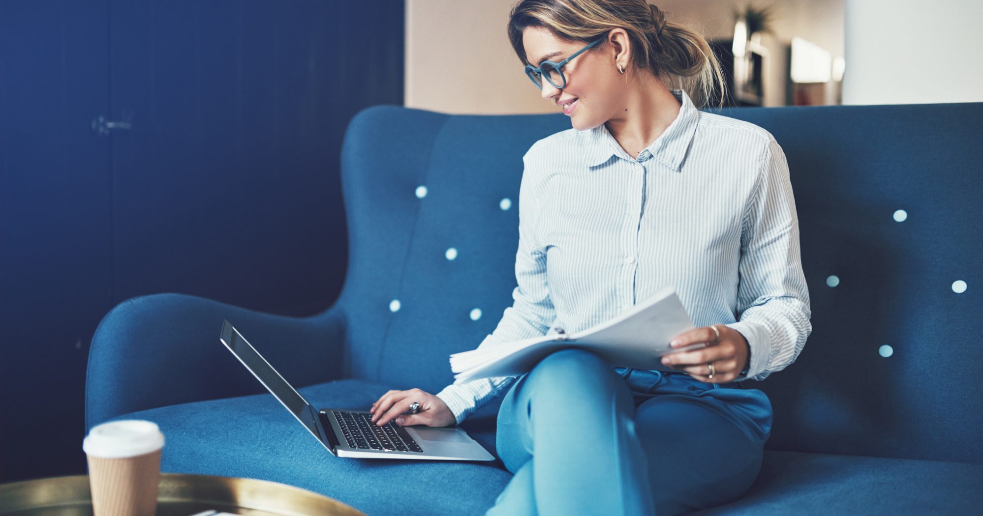 Image of professional woman going through due diligence process as she buys business