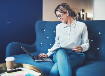 Image of professional woman going through due diligence process as she buys business