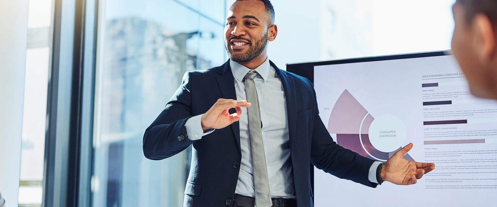 Finance professional presenting financial analysis to coworkers